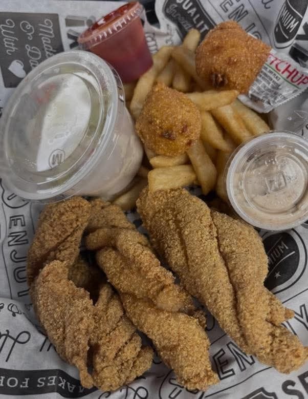 Fried fish basket with fries and sauces